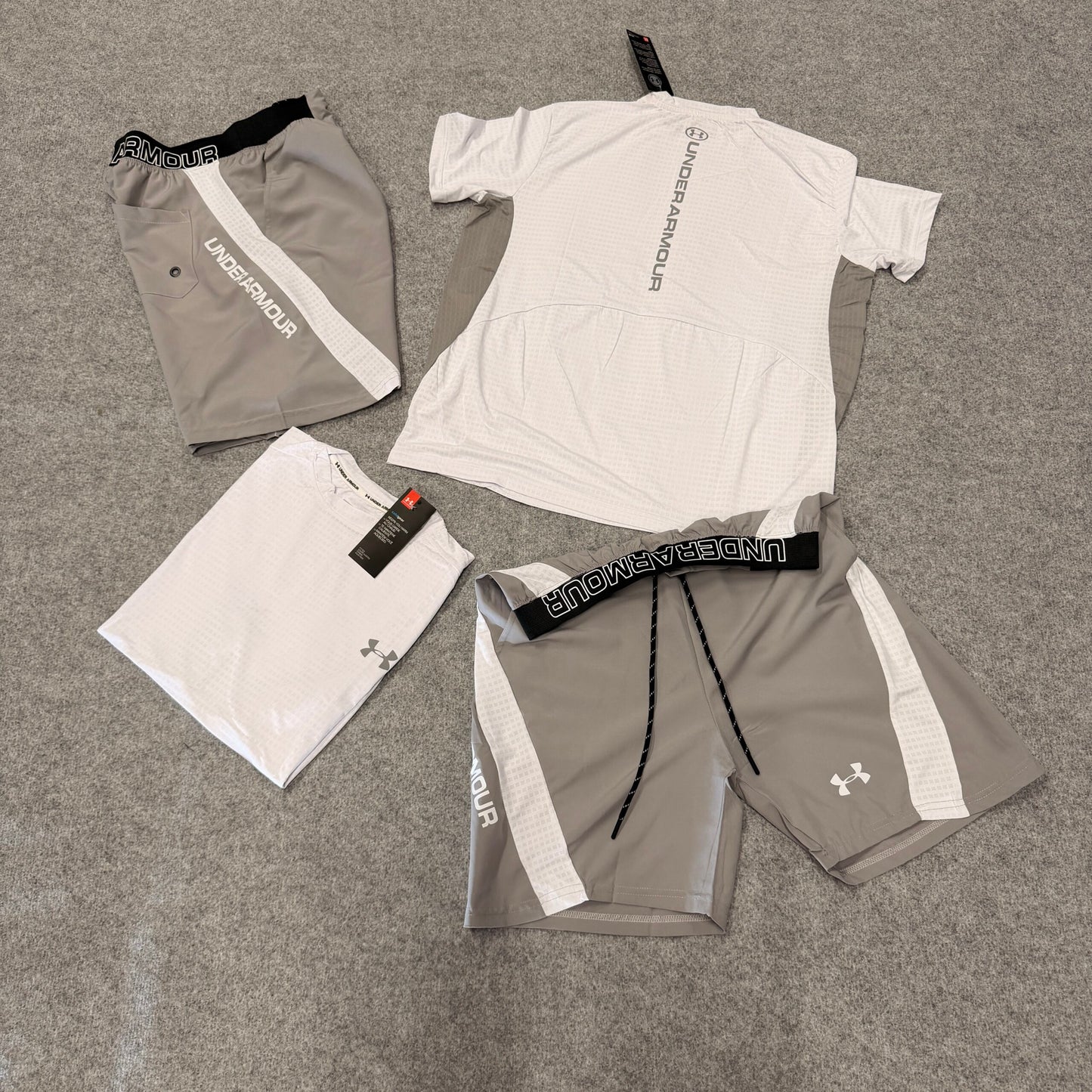 Conjunto under armour gris y blanco detalles negros