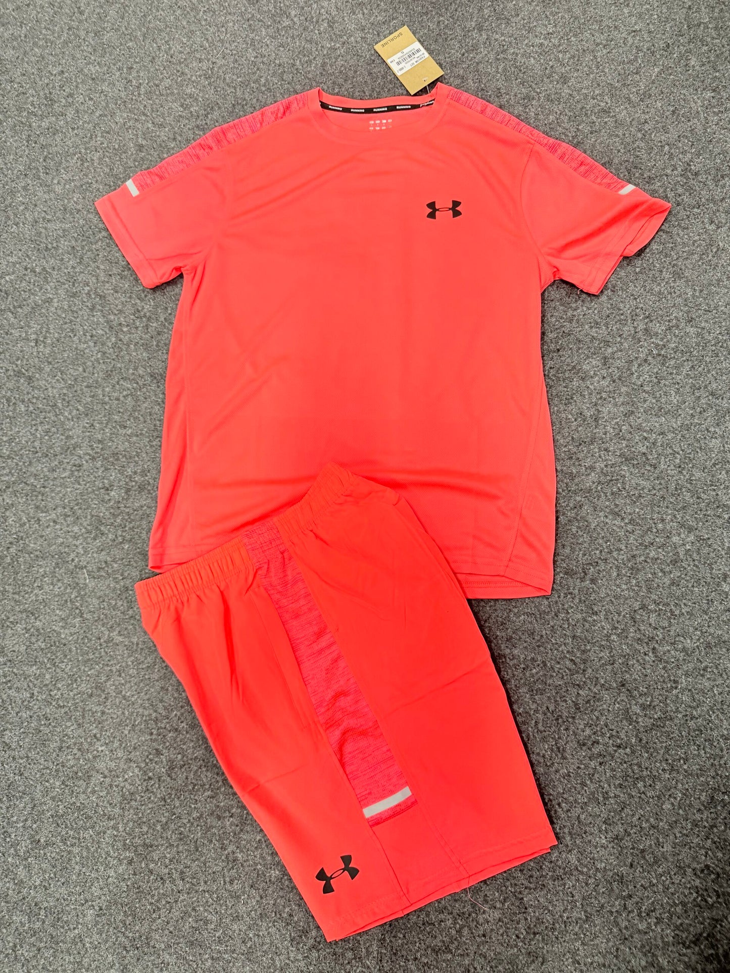 Conjunto Under Armour naranja logo negro