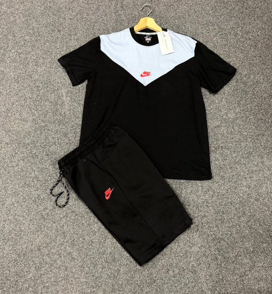 Conjunto nike tech negro y blanco logo naranja