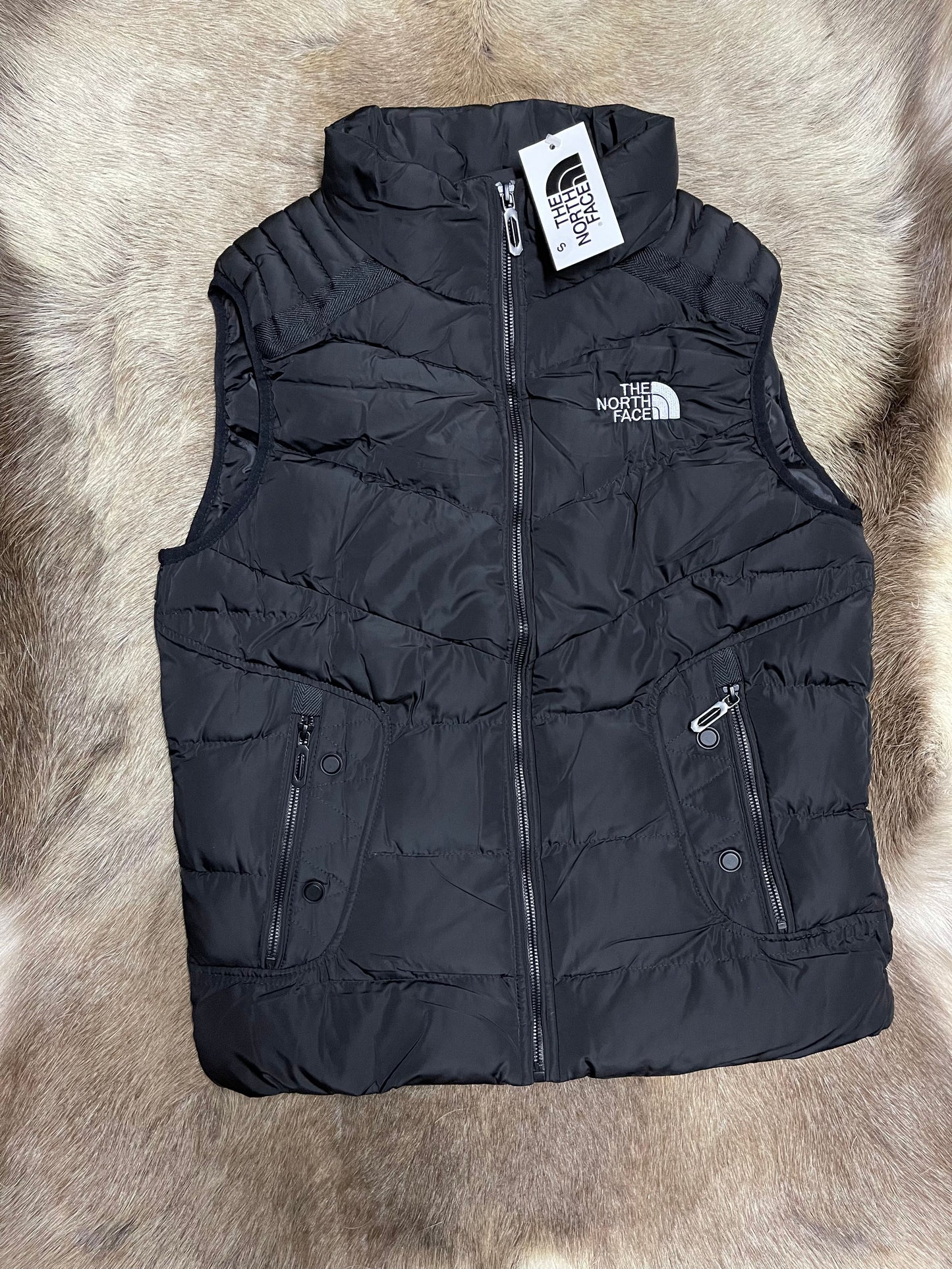 Chaleco North Face negro logo blanco