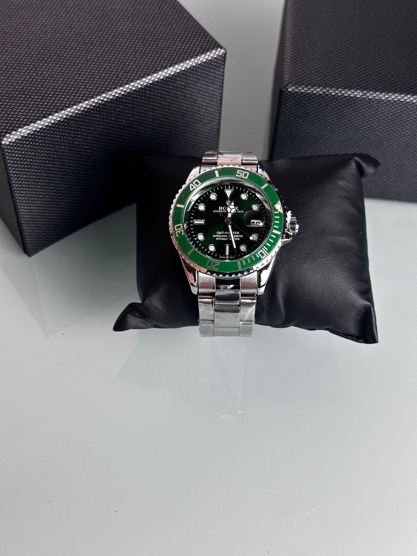 Reloj Rolex plateado verde y negro