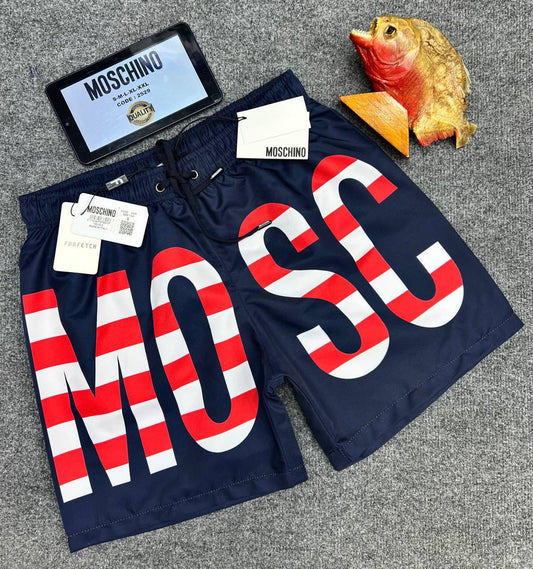 Bañador Moschino azul logo blanco y rojo