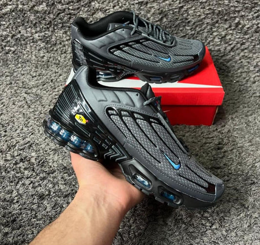 TN Tunned grises logo azul detalles negros