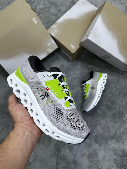 On Cloudmonster grises logo negro detalles verdes