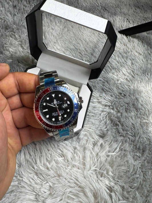 RELOJ ROLEX PLATEADO DETALLES ROJOS Y AZULES
