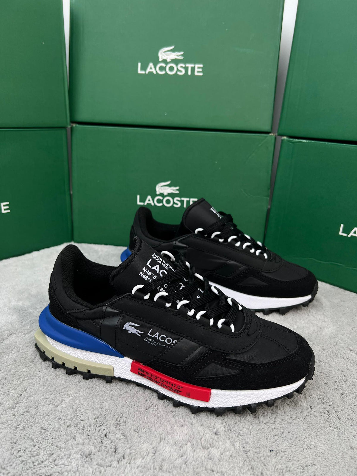 Zapatillas Lacoste Elite Active negro logo blanco detalles azules y rojos