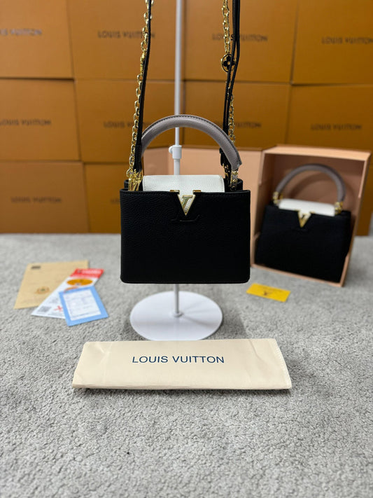 Bolso LV negra y blanca logo dorado