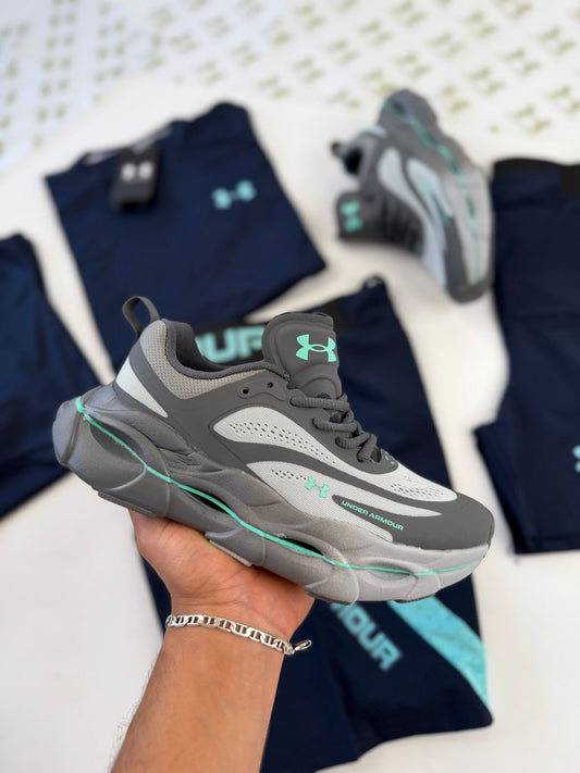 UNDER ARMOUR UA HOVER REACTOR grises logo azul claro