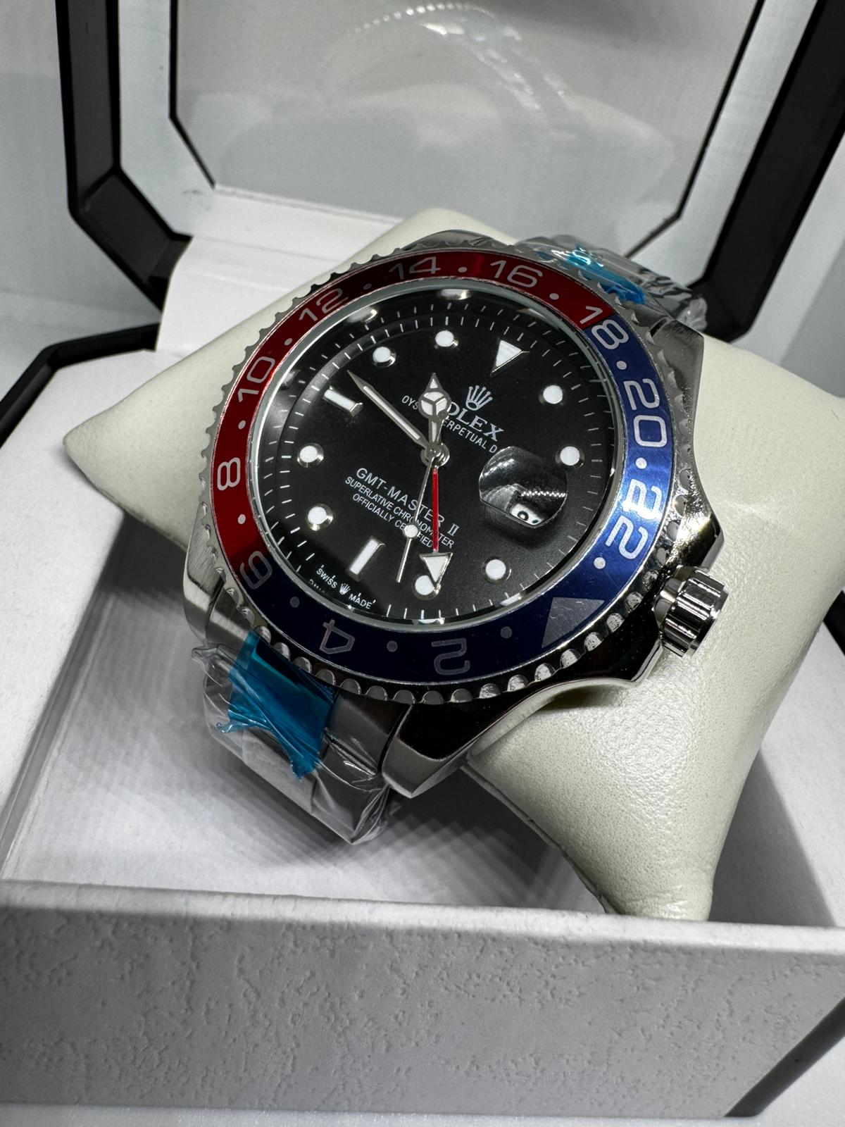 RELOJ ROLEX gris negro rojo y azul