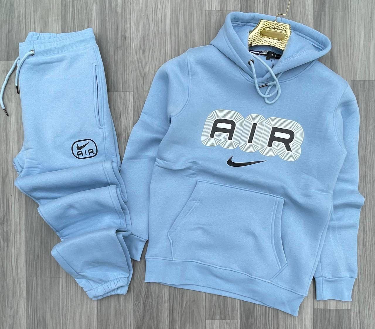 Chandals nike logo central air azul claro