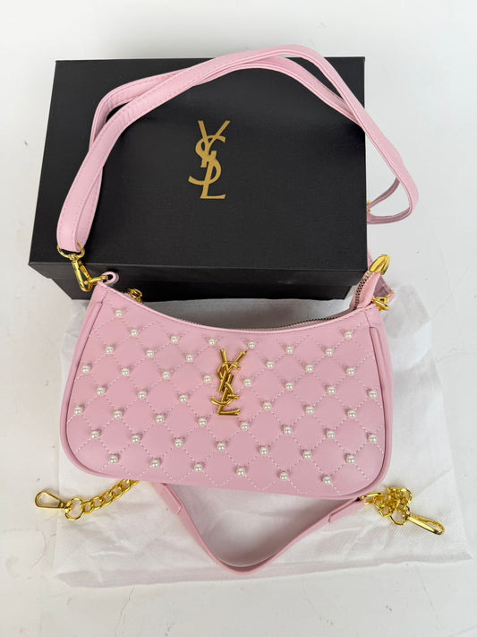 Bolso YSL rosa logo dorado detalles blancos