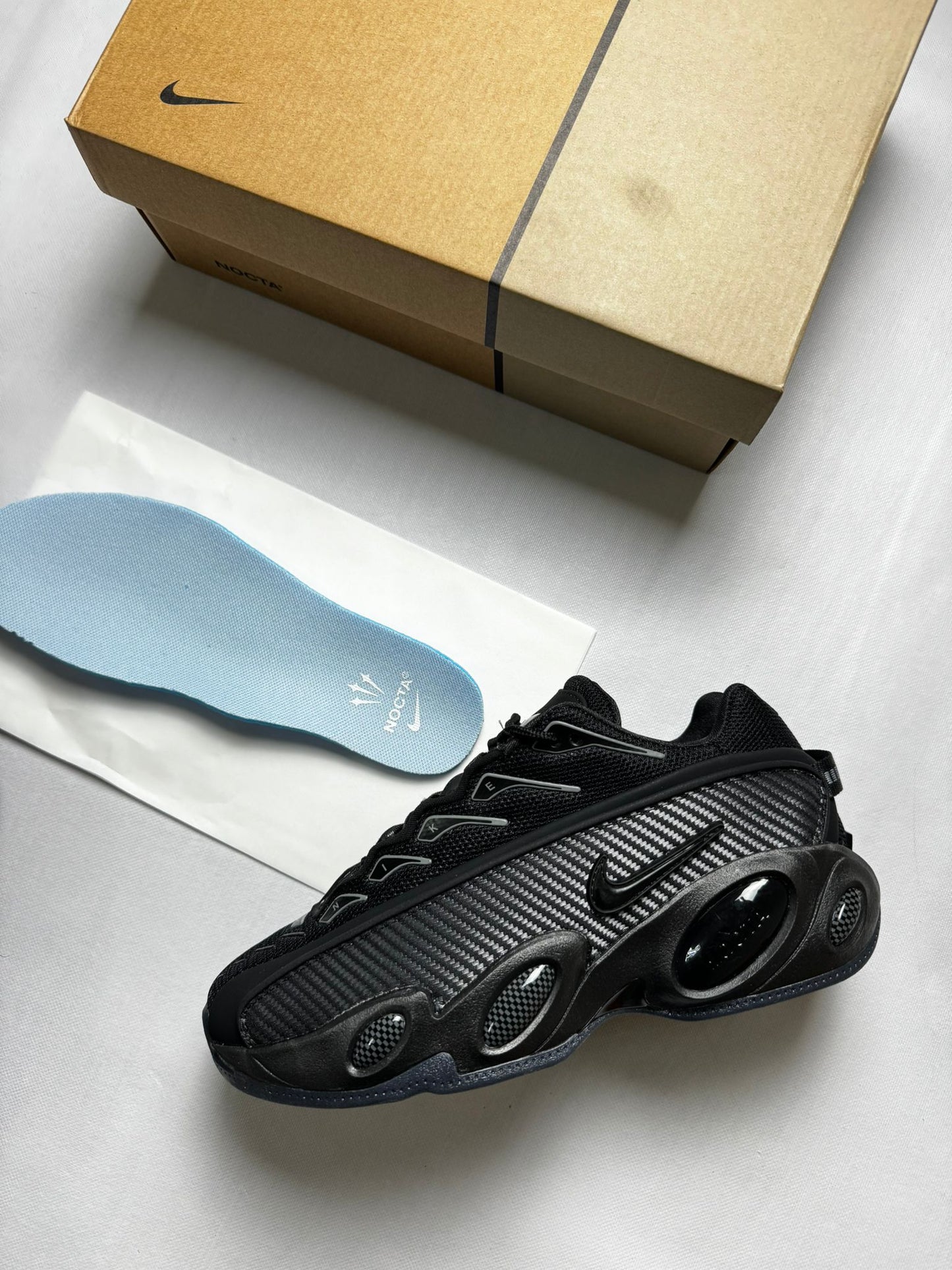 Nike nocta glide negras y plateadas