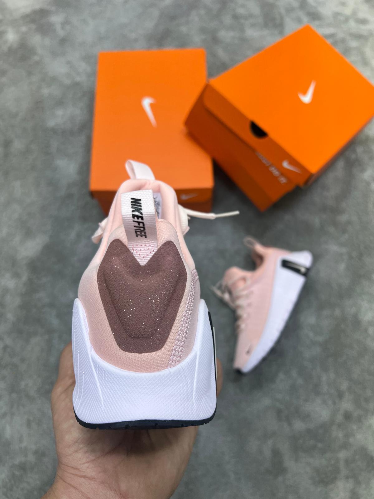 Nike Free Metcon rosa logo negro