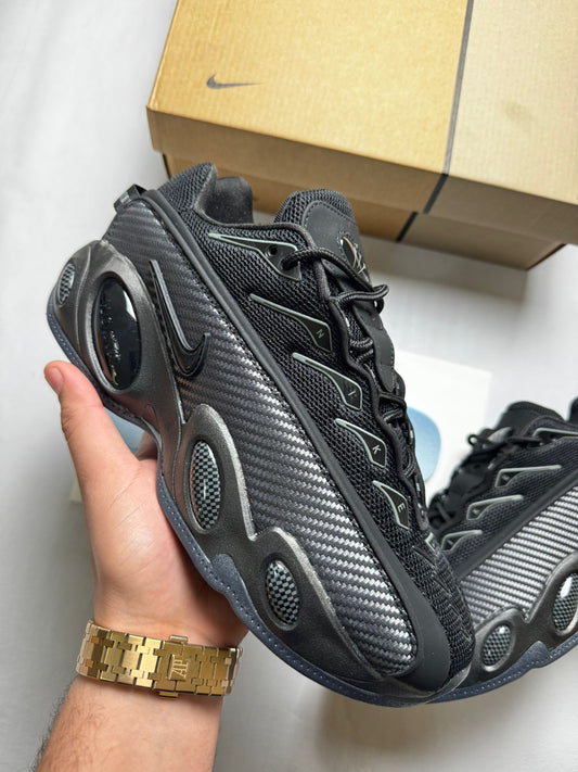 Nike nocta glide negras y plateadas