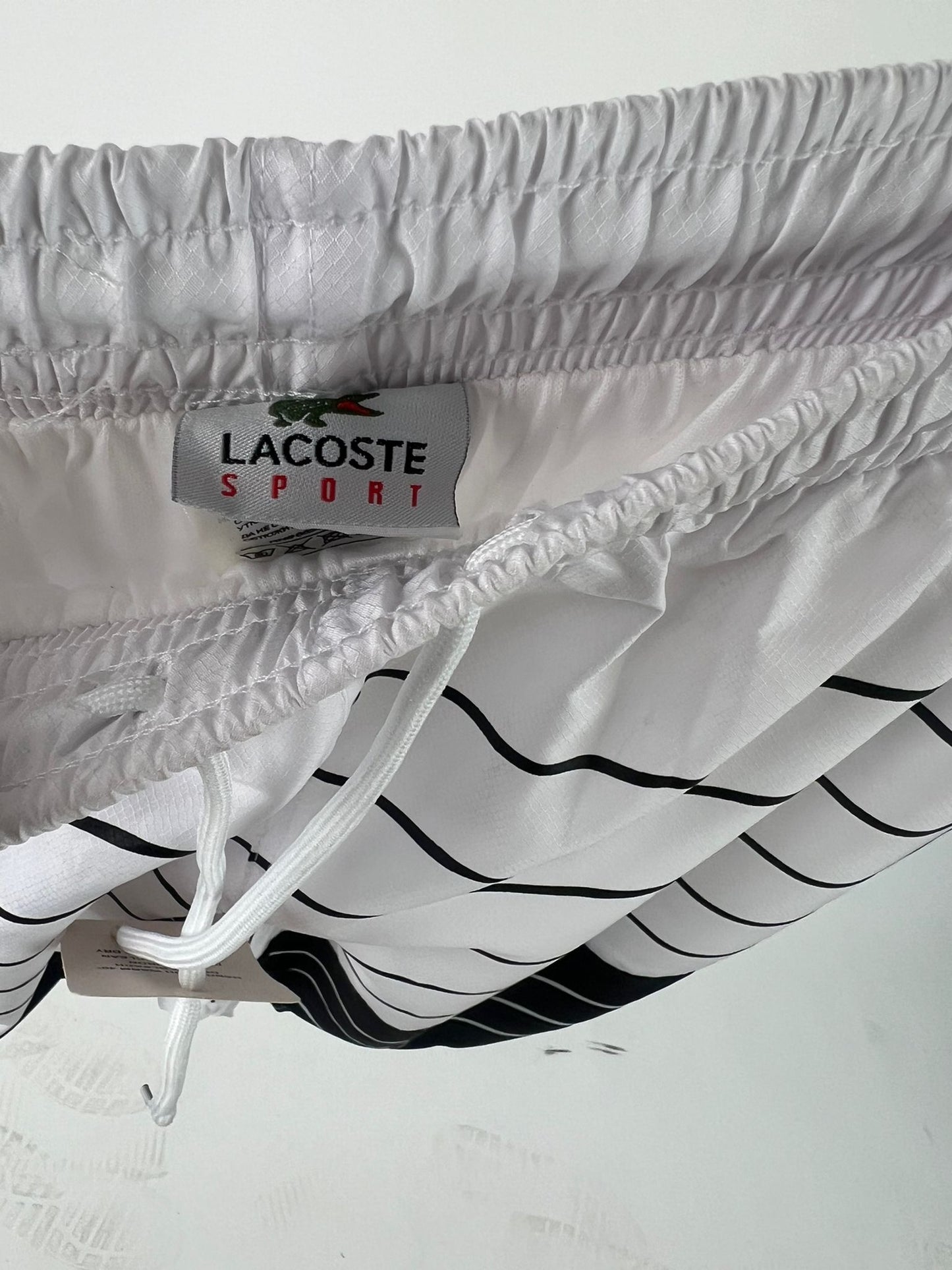 PANTALON CORTO BLANCO LACOSTE