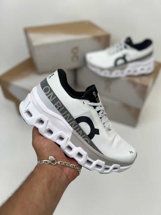Zapatillas On Running Cloudmonster 2 blancas logo negro